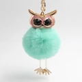 Cute mint green faux fur owl keychain with glittering eyes and gold metal accents - Light Green