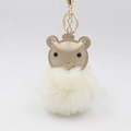 Detail of cream plush fur ball keychain with crown bear head and golden metal ring - Off-white