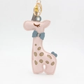 Detail of pink leather giraffe keychain with tassel and gold metal spring clasp - Pink