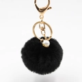 Detail of a black plush pompom keychain with golden lobster clasp and pearl accent charm - Pom Pom Diameter 6CM / Black