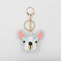 Detailed macro view of French Bulldog keychain with colorful laser leather and gold clasp - Off White