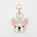 Close-up of the cute PU leather French Bulldog keychain with golden metal ring and lobster clasp - Khaki