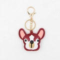 Detail view of burgundy PU leather French bulldog keychain with golden metal hook - Burgundy