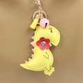 Cartoon yellow leather dinosaur keychain with pink bell and tassel charm for bags - Yellow