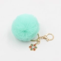 Mint green faux fur pompom keychain with gold snowflake pendant and lobster clasp - Light Green