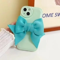 Detail of light green phone case with large blue fabric bow accessory for iPhone - Blue