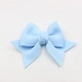 Macro shot of light blue bow accessory made of textured fabric for shoes and bags - Sky Blue