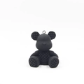 Detail view of a matte black panda bear pendant with textured diamond lattice patterns - Black Character