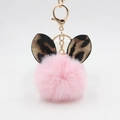 Pink plush ball keychain with leopard print ears and gold metal clasp on white background - Light Pink