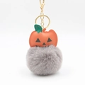 Halloween pumpkin keychain with gray plush pom-pom and gold metal clasp on white background - Light Gray