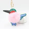 Cartoon hummingbird keychain with pink fluffy fur ball and colorful leather details - Light Pink