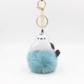 Macro shot of fluffy blue faux fur bird keychain with high-quality gold metal clasp - Lake Blue