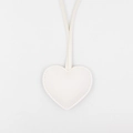 Close-up of white heart-shaped leather keychain with decorative stitching and long strap - White