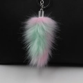 Pink and mint green faux fur fox tail keychain with silver metal clip on white surface - Multicolor (Color 1)