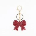 Ciondolo a fiocco in resina rosso scuro con moschettone dorato per portachiavi e accessori - Portachiavi Fiocco Grande