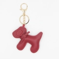 Porte-clés chien Golden Retriever en cuir PU rouge avec fermoir mousqueton doré sur fond blanc - Bordeaux