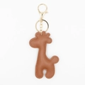 Close-up of brown PU leather giraffe keychain with gold metal clasp and stitching details - With Keychain / Coffee