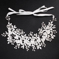 Luxurious bridal hairband with crystal flowers and silver wire on a black background - Silver Floral Vine Rhinestone Ribbon Hair Accessory (HS-J5054)