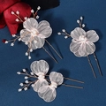 Detailed macro view of delicate metal wire petals and white pearls on bridal hair pins - Gold Triple Style (HS-J6333G) / 3pcs / Gold
