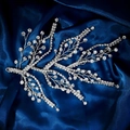 Macro shot of silver bridal hairpiece with shimmering crystals on dark blue silk - Branch Shape Rhinestone Hair Vine (HS-J7331S)