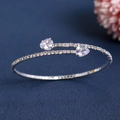 Close-up of sparkling rhinestone open cuff bracelet with heart-shaped crystal ends - Silver Teardrop Style (BS-J5417 Silver)