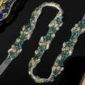 Macro shot of hand-sewn green and white crystal rhinestones on sheer bridal belt mesh - Emerald Green Rhinestone (WS-J249)