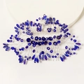 Détail d'un peigne à cheveux de mariée avec cristaux bleu roi et fils d'argent - Peigne à Cheveux Branche et Feuille Bleue Radiale (HS-J6470)