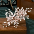 Detailed macro view of rose gold bridal hair pins with intricate crystals and metal leaves - Rose Gold Floral Hair Clip (HS-J6505RG)