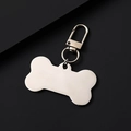 Close-up of bone-shaped metal pet tag with lobster clasp and blank engraving surface - 50x28mm+34mm Clasp / Silver