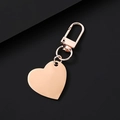 Elegant rose gold heart pendant keychain with spring D-ring on black background - Slanted Heart / 30x28.5mm / Rose Gold