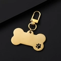 Polished gold bone-shaped pet ID tag with cutout paw design and lobster clasp - Large Bone (Hollow Paw) 34mm Clasp / Gold