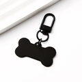 Detail view of bone shaped metal pet ID tag in black with lobster clasp and ring - Black Bone Shape Clip