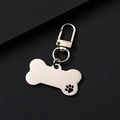 Polished silver bone-shaped metal pet ID tag with hollowed claw pattern and clasp - Hollow Bone Shape Clip