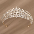 Close-up of luxury bridal crown with golden base and teardrop crystals on velvet - Gold Exquisite Floral Radial Style (TS-J3256G)