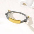 Minimalist grey braided rope bracelet with adjustable knots and gold stainless steel plate - Grey Rope / Gold Metal Plate