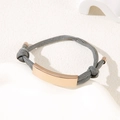 Adjustable grey braided rope bracelet with a smooth rose gold metal curved bar - Grey Rope / Rose Gold Metal Plate