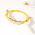 Adjustable bright yellow braided rope bracelet with a polished rose gold curved metal bar - Yellow Rope / Rose Gold Metal Plate