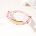 Adjustable pink braided rope bracelet featuring a polished gold stainless steel bar - Pink Rope / Rose Gold Metal Plate