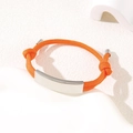 Adjustable orange braided rope bracelet with a polished silver curved metal plate - Orange Rope / Silver Metal Plate