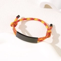 Adjustable red and yellow braided rope bracelet with a matte black metal ID bar charm - Red Yellow Rope / Black Metal Plate