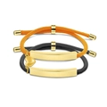 Detail of woven rope bracelets with gold curved plates, heart charm and adjustable slider - Gold Plate (Black and Orange Rope)