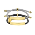 Detail view of woven couple bracelets with golden metal plates and heart charms - Gold Plate (Black and Gray Rope)