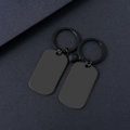 Detail of magnetic heart connection between two black matte stainless steel couple keychains - Black (Pair)