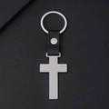 Cross-shaped silver brushed metal keychain with black leather strap and rivet detail - Silver Cross
