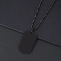Macro shot of matte black stainless steel military dog tag with a square box chain necklace - 50x28mm (06-03) / Black