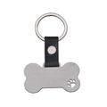 Detail of bone-shaped pet ID tag with black leather strap and laser-cut paw print - Silver Paw Cutout Bone Style / Silver Leather 50x27.6mm Bone (Paw Cutout) Keychain
