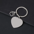 Polished silver heart-shaped metal keychain with paw charm on black textured background - 30mm Heart Silver