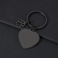 Detail of matte black heart keychain with laser-engraved cat paw pendant and round ring - 30mm Heart Black