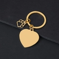 Polished gold heart keychain with hollow paw pendant on a dark matte background - 30mm Heart Gold