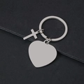 Macro view of polished heart-shaped metal keychain with cross pendant for engraving - Heart Style / Silver